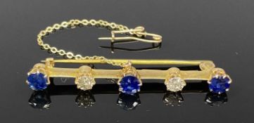 15CT GOLD DIAMOND & BLUE SAPPHIRE BAR BROOCH, two 0.20ct diamonds and three blue sapphires with