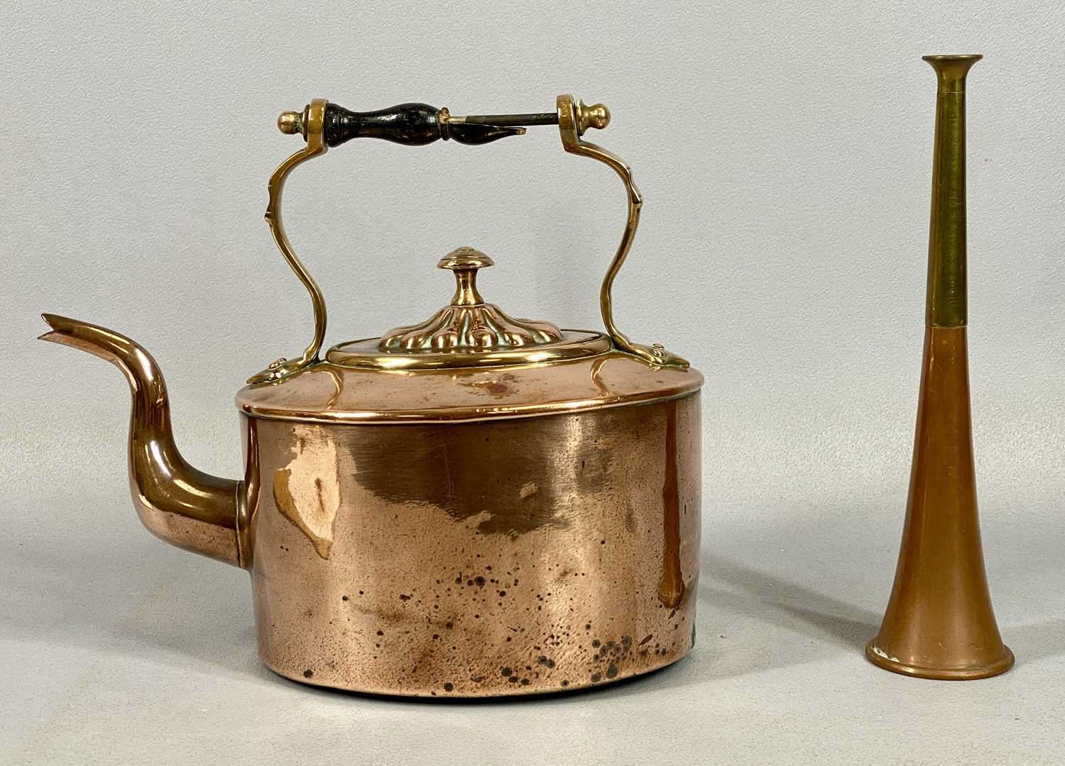 EARLY 20TH CENTURY METALWARE, oval copper kettle with turned wood handle, 23cms (h) and a copper and