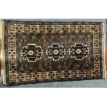 PERSIAN BLUE/BROWN GROUND HANDMADE WOOL RUG, triple medallion centre, floral border, 140 x 85ms