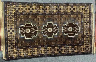PERSIAN BLUE/BROWN GROUND HANDMADE WOOL RUG, triple medallion centre, floral border, 140 x 85ms