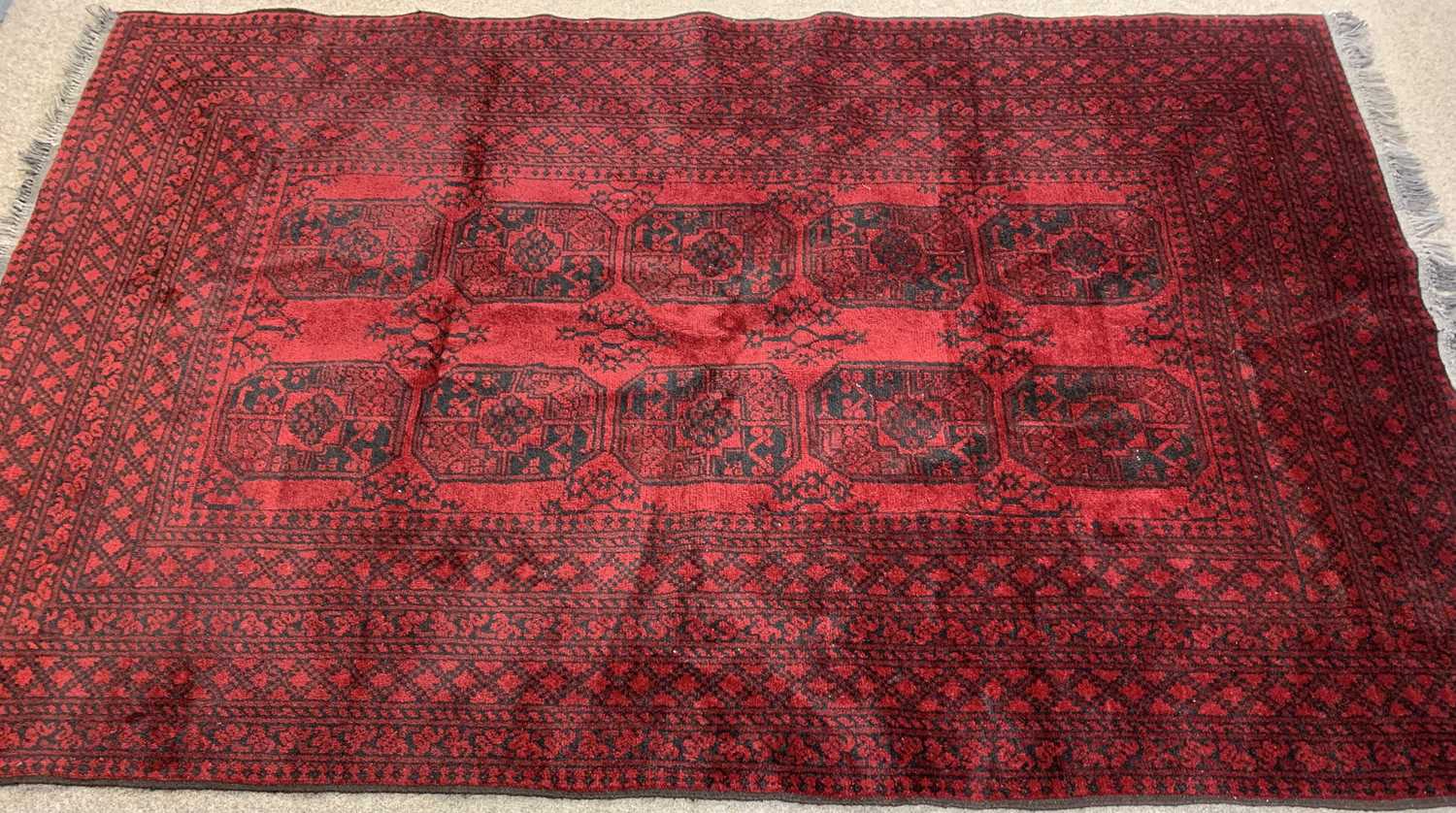 PERSIAN RED GROUND HANDMADE WOOL RUG, medallion centre with multiple geometric border, 234 x - Image 2 of 3