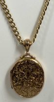 9CT GOLD OVAL LOCKET & A FLAT CURB LINK NECKLACE, 5cms (l) including hanging loop the locket,