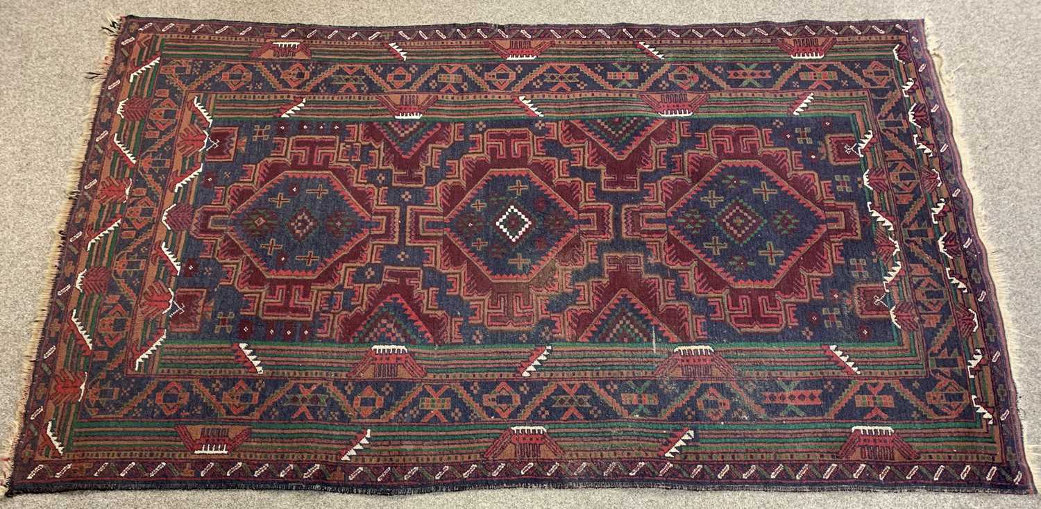 PERSIAN RED/BLUE GROUND HANDMADE WOOL RUG, triple medallion centre, geometric border, 192 x 113cms - Image 2 of 3