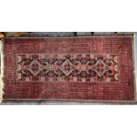 PERSIAN RED GROUND HANDMADE WOOL RUG, triple medallion centre, geometric border, 196 x 300cms