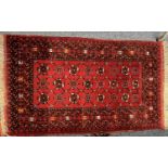 AFGHAN RED GROUND HANDMADE WOOL RUG, 154 x 90cms Provenance: deceased estate Conwy