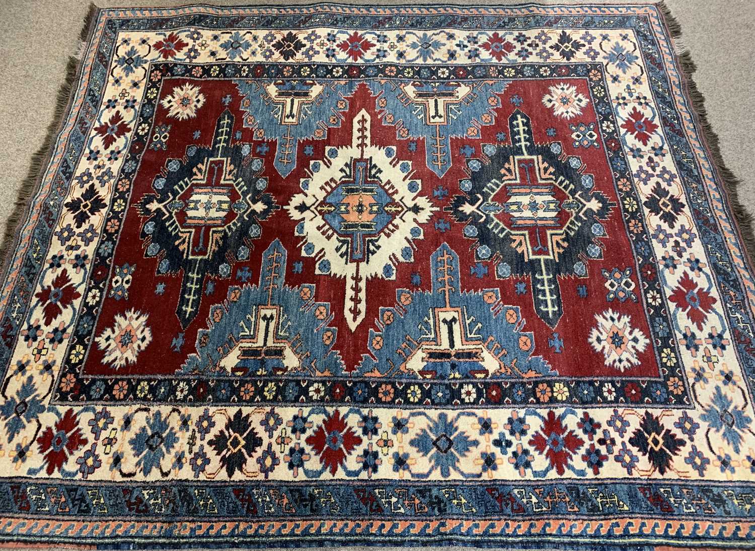 PERSIAN RED, BLUE & CREAM GROUND HANDMADE WOOL RUG, medallion centre, floral and geometric border, - Image 2 of 3