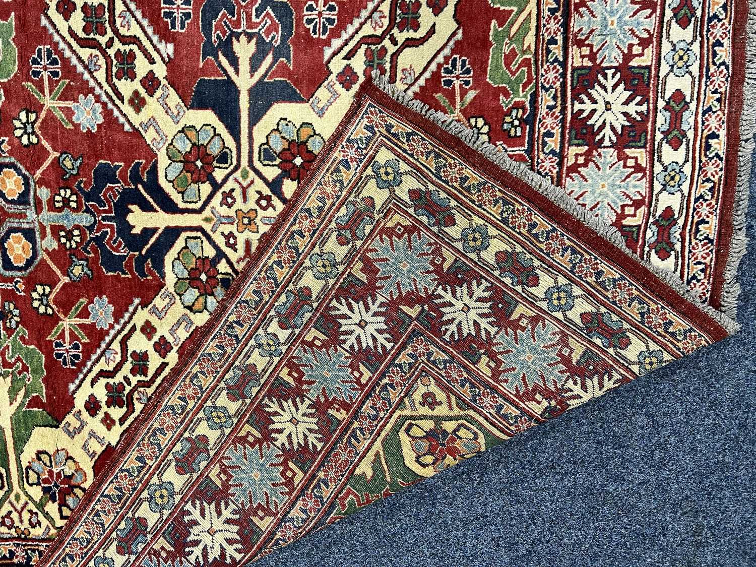 PERSIAN RED BLUE & CREAM GROUND HANDMADE WOOL RUG, floral border, 250 x 188cms Provenance: - Image 3 of 3