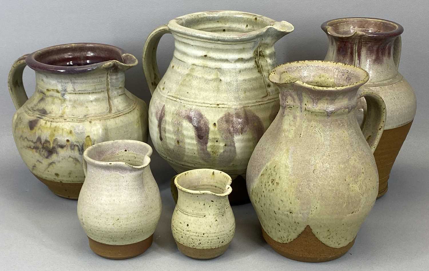 GROUP OF TREFOR OWEN OF MAENTWROG STONEWARE STUDIO POTTERY, including four harvest jugs, 28cms (h) - Image 2 of 3