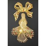 TWO 9CT GOLD GARNET SET BROOCHES, the first with a central pearl, brooch fashioned as a twisted knot