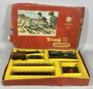 A TRI-ANG RAILWAYS OO GAUGE TRAIN SET with locomotive tender, two carriages, controller and some