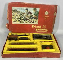 A TRI-ANG RAILWAYS OO GAUGE TRAIN SET with locomotive tender, two carriages, controller and some