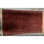 PERSION RED GROUND HANDMADE WOOL RUG, geometric border, 144 x 84cms Provenance: deceased estate