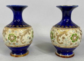 A PAIR OF ROYAL DOULTON STONEWARE early 20th century, bulbous bodies with slender necks and flared