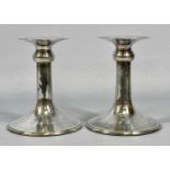 PAIR OF ELIZABETH II SILVER CANDLESTICKS plain contemporary design, flared drip pans, spreading