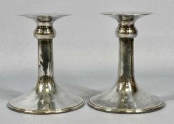PAIR OF ELIZABETH II SILVER CANDLESTICKS plain contemporary design, flared drip pans, spreading