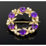 9CT GOLD AMETHYST & SEED PEARL CIRCULAR BROOCH, Birmingham 1973, Cropp and Farr Ltd, 3cms (diam.),