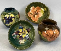 FOUR ITEMS OF MOORCROFT comprising coral hibiscus green ground circular footed bowl, impressed