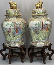 LARGE CHINESE FAMILLE ROSE LIDDED BALUSTER VASES, A PAIR - enamelled painted with figures and