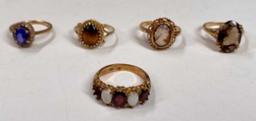 FIVE 9CT GOLD DRESS RINGS, blue sapphire and paste, size K, cameo, size O, smoky quartz, size M,