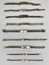 EIGHT SILVER & ONE WHITE METAL IDENTITY BRACELETS comprising large chunky '925' stamped bracelet,