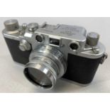 GROUP OF CAMERAS comprising Leica B.R.P Leizt Vetzlar No. 366417 in leather case, a Nikon