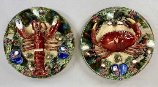 PAIR OF ALVARO JOSE CALDAS DA RAINHA PALISSY WARE DISHES decorated in relief with crab and a lobster