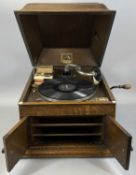 HIS MASTERS VOICE TABLE GRAND WIND UP GRAMOPHONE PLAYER, 1920s, in oak case, 33 (h) x 39.5 (w) x