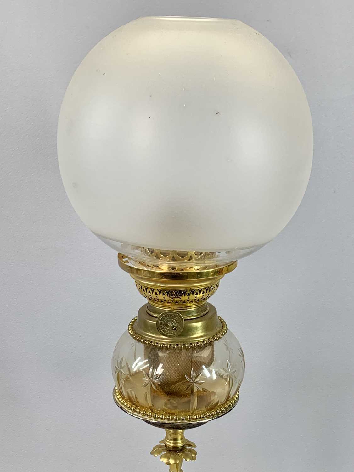 VICTORIAN GILDED BRASS OIL LAMP with figural column, clear glass reservoir with star cut decoration, - Image 2 of 2