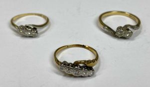 THREE 18CT GOLD & PLATINUM DIAMOND SET CROSSOVER DRESS RINGS, three stone, mid K - L, two stone, mid