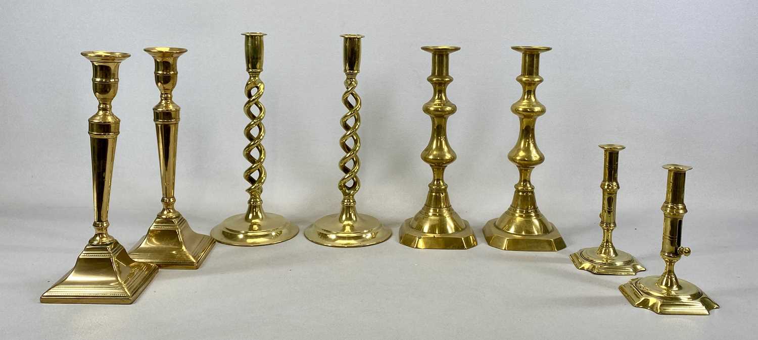 FOUR PAIRS OF BRASS CANDLESTICKS 18th Century and later, including pair with push up columns,