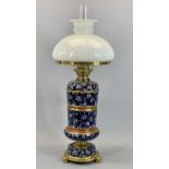 VICTORIAN TAYLOR & TUNNICLIFFE BLUE & WHITE FLORAL CERAMIC OIL LAMP with gilded metal mounts, single