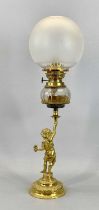 VICTORIAN GILDED BRASS OIL LAMP with figural column, clear glass reservoir with star cut decoration,