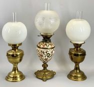 THREE OIL LAMPS comprising Victorian with removable reservoir and column in floral enamelled
