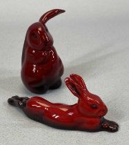 TWO ROYAL DOULTON FLAMBE FIGURES, seated rabbit with cocked ear, 7cms (h) and hare lying down, 10cms