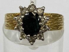 18CT GOLD BLUE SAPPHIRE & DIAMOND CLUSTER RING, facet cut 0.75ct central stone, surrounded by ten