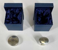 TWO MODERN SILVER BOXES comprising oval lidded ring box, 3cms (h) and a circular and lidded pill