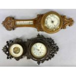 TWO VICTORIAN & LATER WALL BAROMETERS, comprising cast iron frame example with lower clock and upper