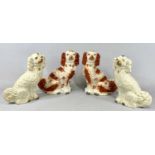 TWO PAIRS OF STAFFORDSHIRE POTTERY DOGS, red and white pair, 31cms (h), gilt and white pair,