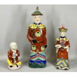 CHINESE STATUES (3), Earthenware figure of a Mandarin dignitary, colourful polychrome decoration,