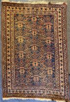 INDIAN RED, BLUE & CREAM RUG, medallion and floral centre, triple floral border, 182 x 127cms
