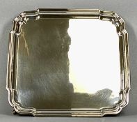 EDWARD VIII SQUARE SILVER SALVER, shaped raised border, four stepped hoof feet, Birmingham 1937,