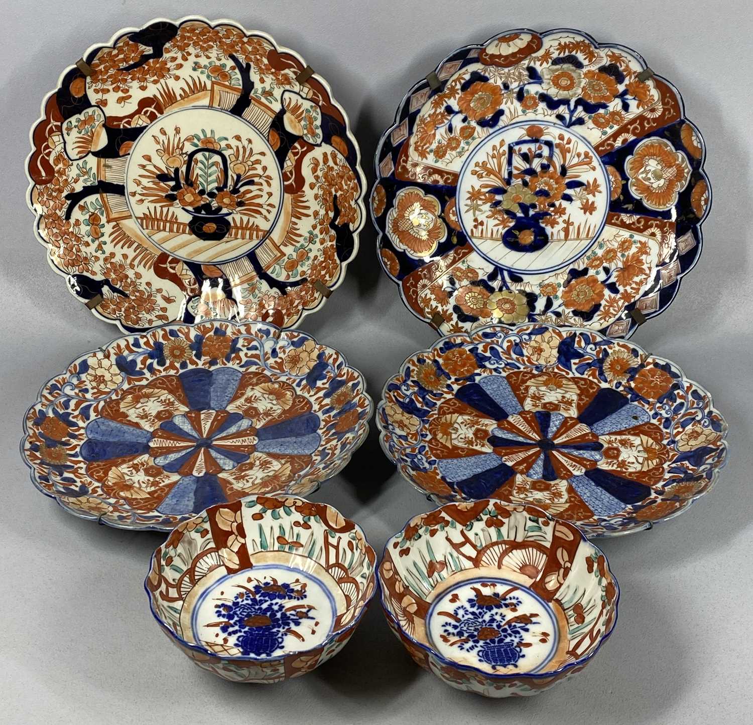 GROUP OF JAPANESE IMARI comprising circular chargers, late 19th/early 20th century, a pair with