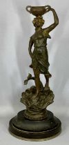 BRONZED SPELTER FIGURE of a lady holding two handled pot aloft, oval ebonised plinth, 63cms (h)