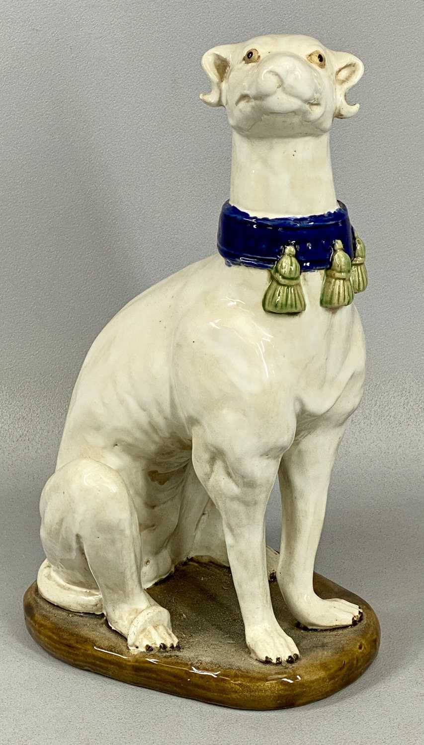 PAIR OF ITALIAN MAJOLICA GREYHOUNDS 20th century, seated and in cream glaze with tassled blue - Image 3 of 5