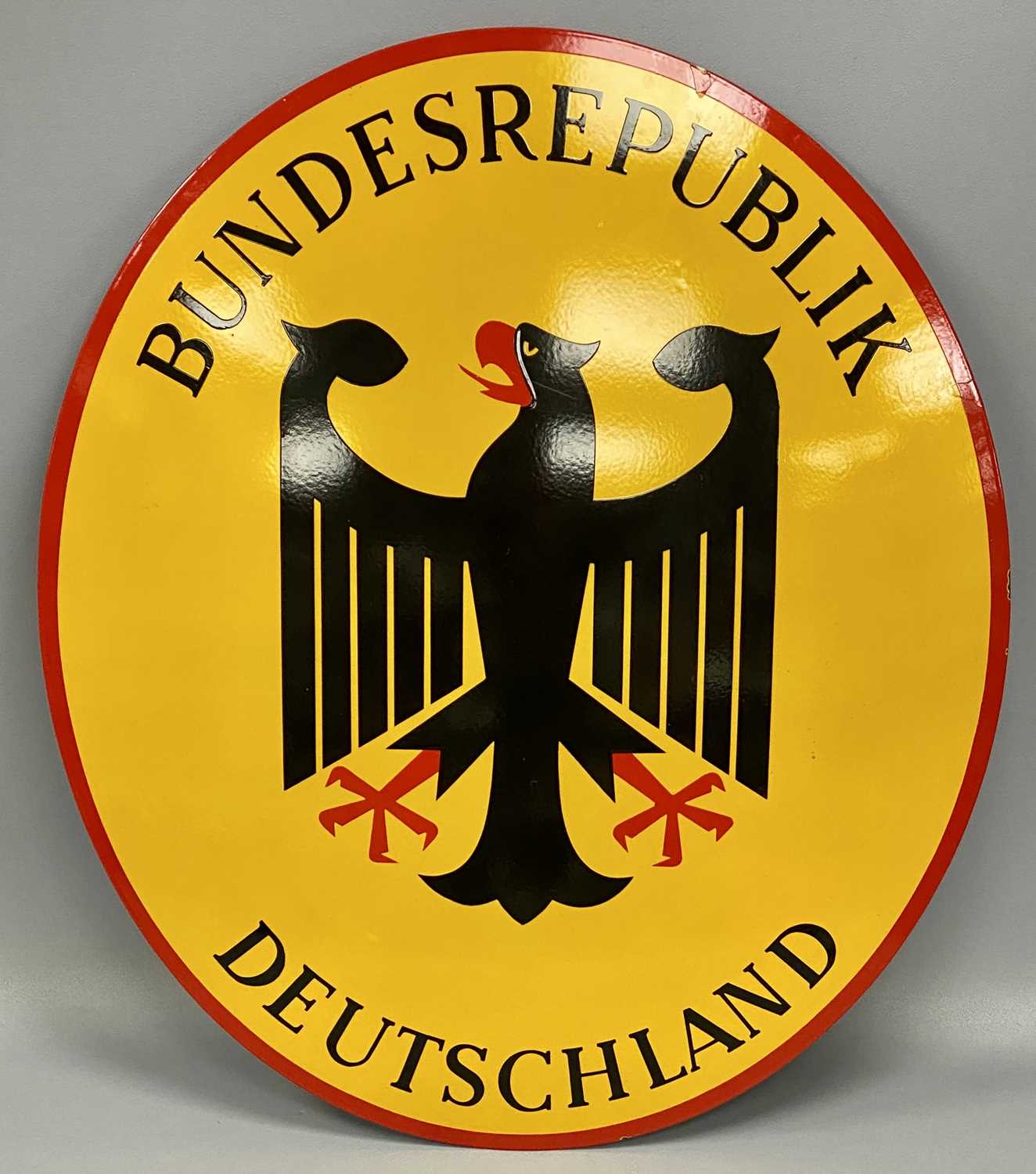BUNDESREPUBLIK DEUTSCHLAND ENAMEL BORDER SIGN, convex oval format, black and red on yellow ground,