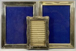 THREE SILVER PHOTOGRAPH FRAMES being a matching pair and one other, the smallest example