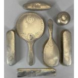 SEVEN SILVER MOUNTED DRESSING TABLE ITEMS comprising a matching five piece circular hand mirror,