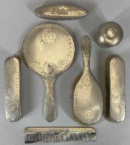 SEVEN SILVER MOUNTED DRESSING TABLE ITEMS comprising a matching five piece circular hand mirror,