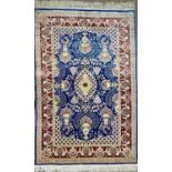 TURKISH HAND MADE SILK CARPET, blue, red and cream ground, centre field with oval medallion, birds
