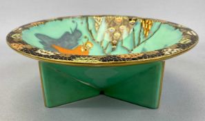 CARLTON WARE CIRCULAR TRI-FOOTED BOWL, printed, enamelled and gilded in the "Mephistopheles" pattern